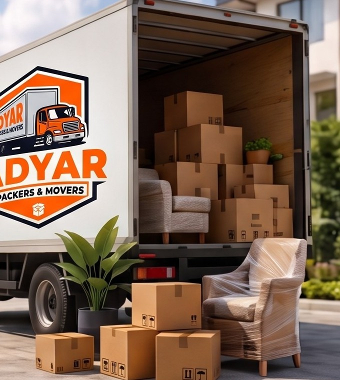 Adyar Packers and Movers truck loaded with boxes and wrapped furniture